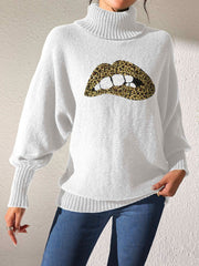 White turtleneck sweater with sequin leopard print lips detail and balloon sleeves.