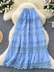 Blue tiered maxi skirt with lace trim and drawstring waist.