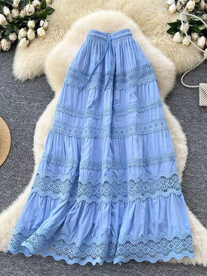 Blue tiered maxi skirt with lace trim and drawstring waist.