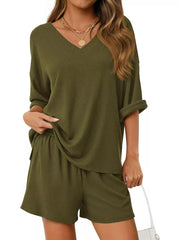 Sage green ribbed V-neck lounge set with cuffed short sleeves and drawstring shorts.