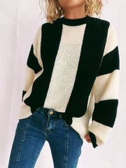 Black and cream vertical stripe waffle knit sweater with crew neck.