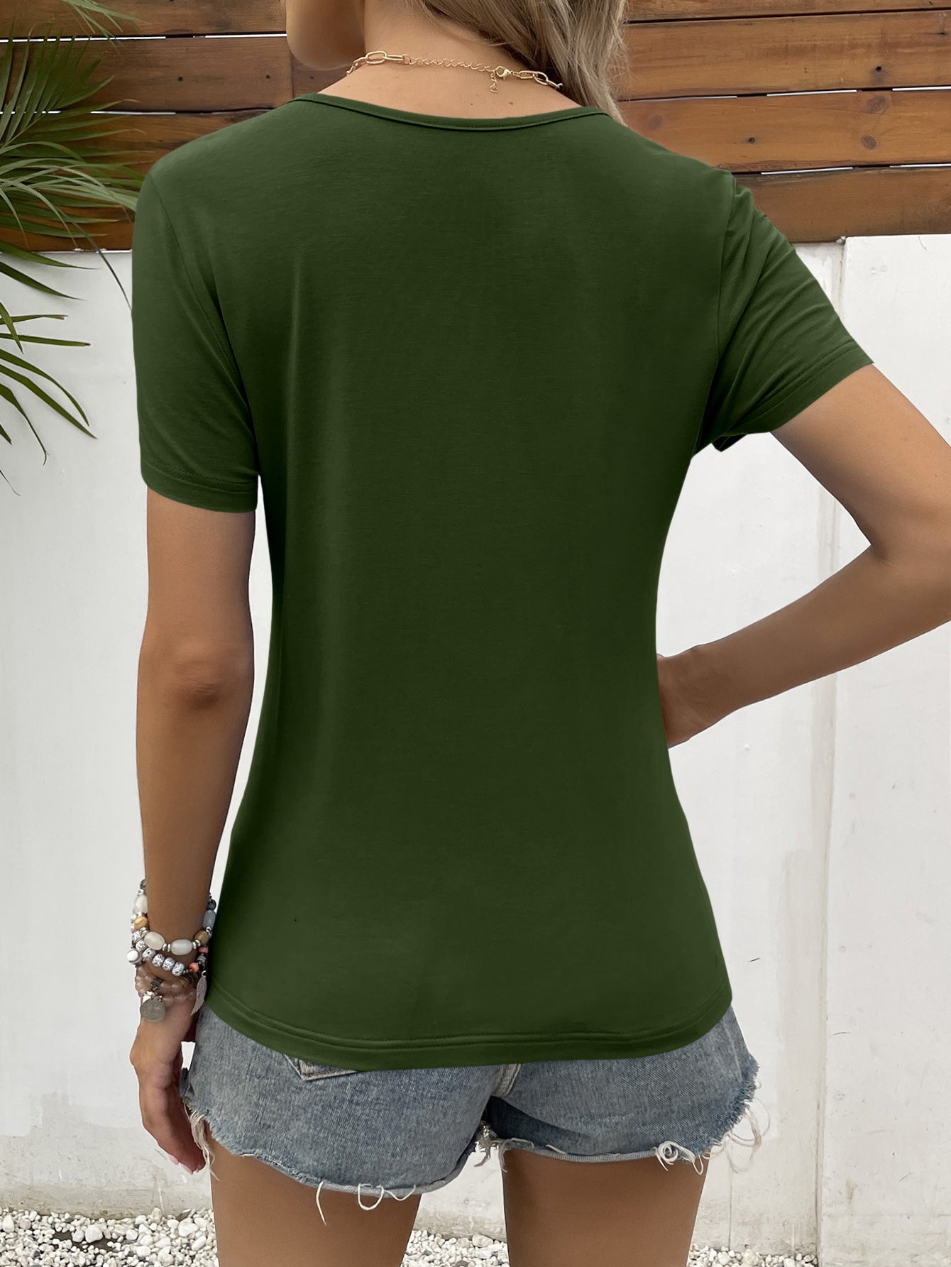 Army green short sleeve tee with lace trim detail.