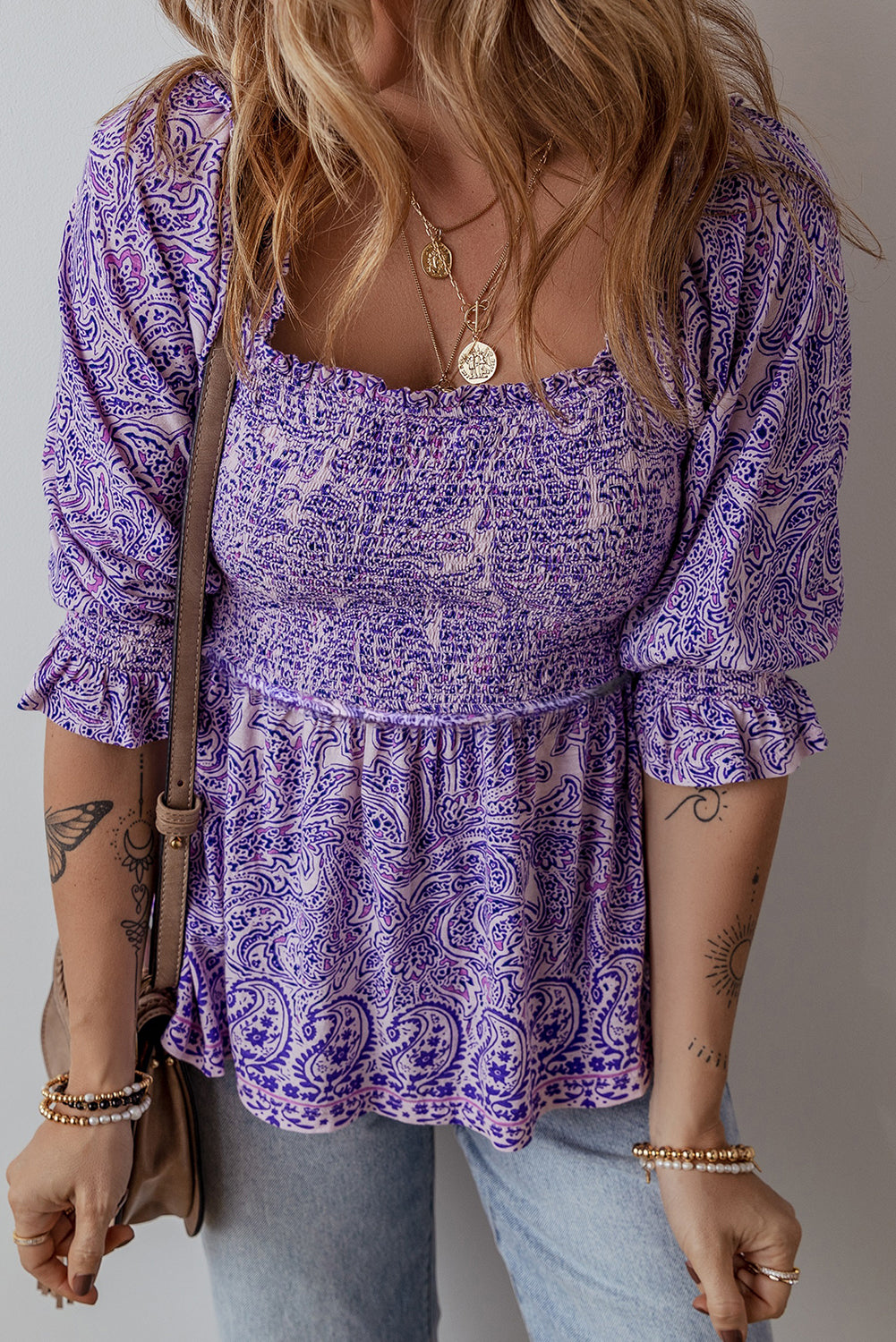 Paisley smocked bodice blouse in lavender with square neckline and puff sleeves.