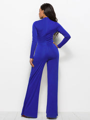 Royal blue high-waisted palazzo jumpsuit with long sleeves and a back zipper.