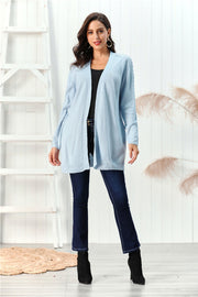 Light blue cable knit open front cardigan with braided sleeve detail.