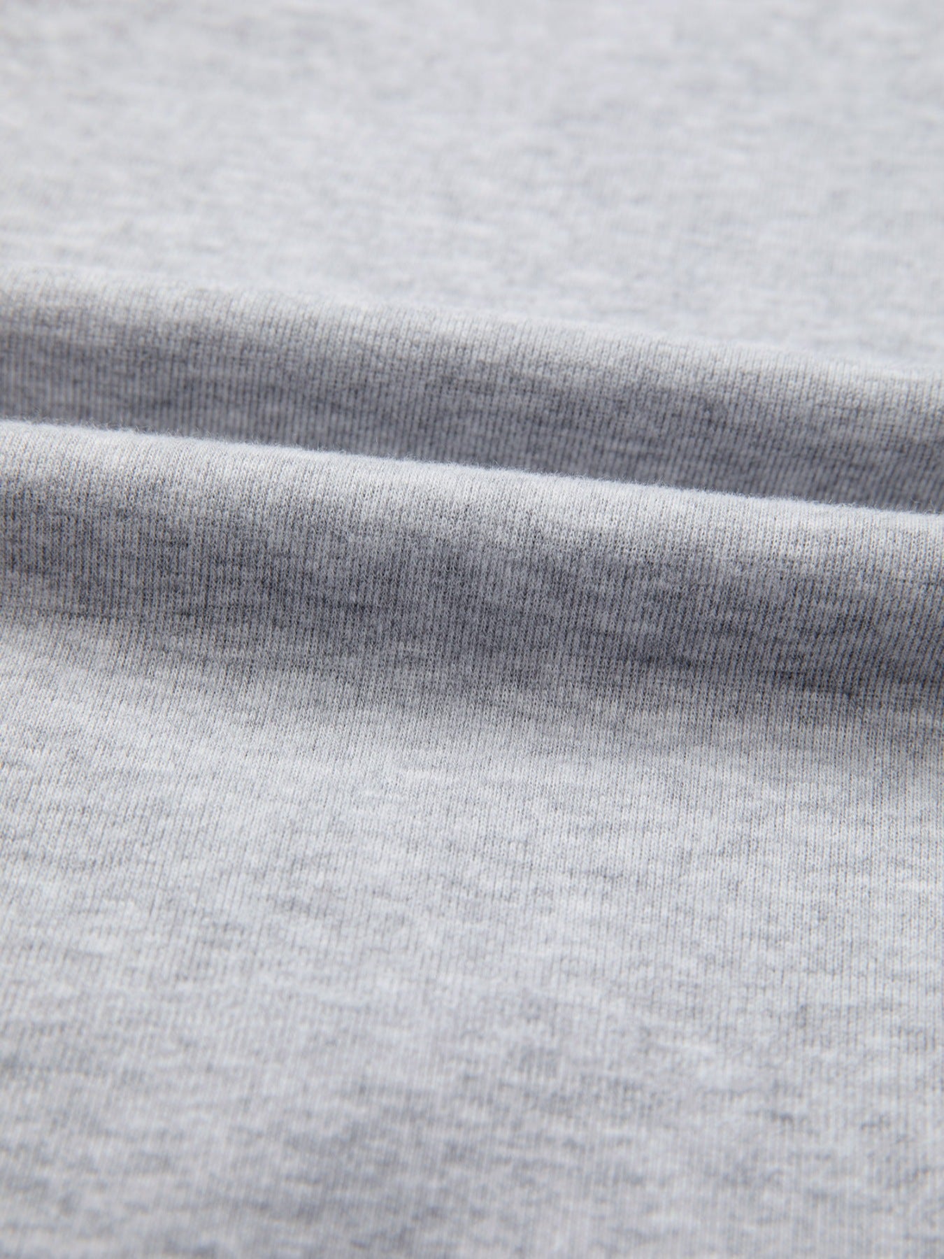 Grey raglan shirt fabric detail