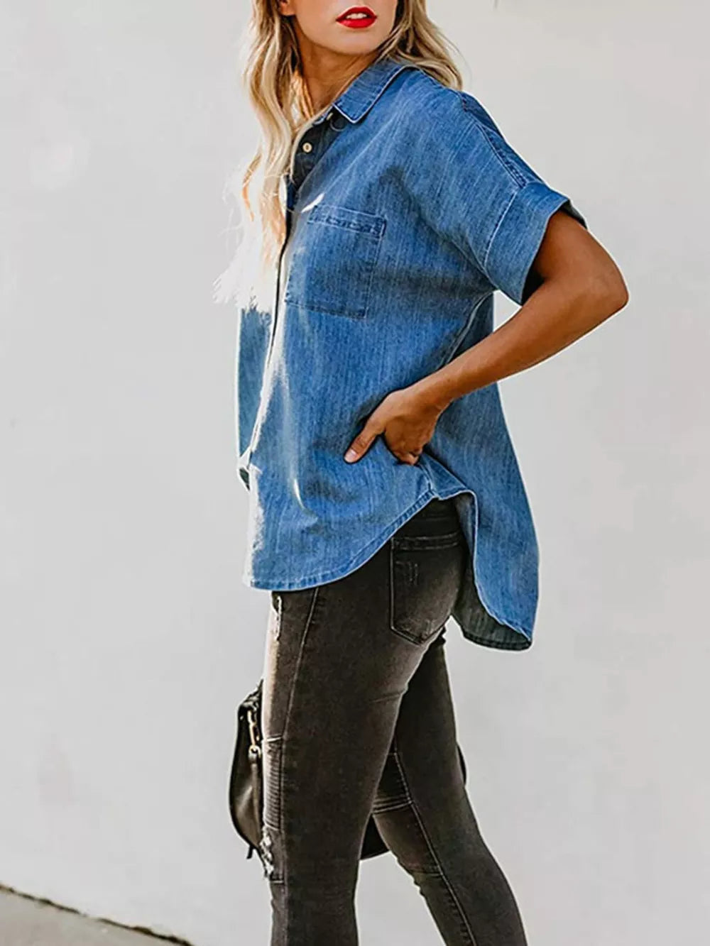 Denim button-front top in dark blue with short sleeves and a chest pocket.