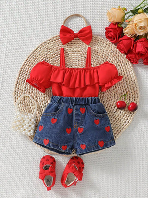 Red ruffled cold shoulder top and denim shorts with heart embroidery, includes red bow headband.