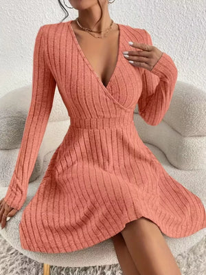 Burnt Coral ribbed wrap mini dress with long sleeves and a V-neckline.