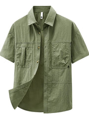 Bean green casual button-up shirt with short sleeves and two chest pockets.