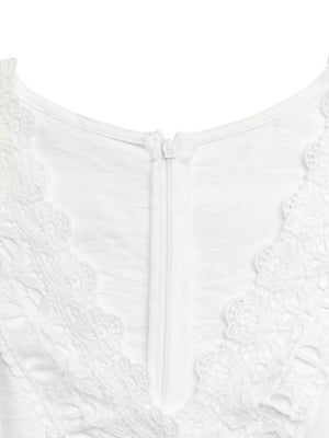 White lace-trimmed wide-leg romper with a zipper closure