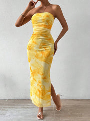 Yellow ruched bodycon midi dress with a tie-dye print and thigh slit