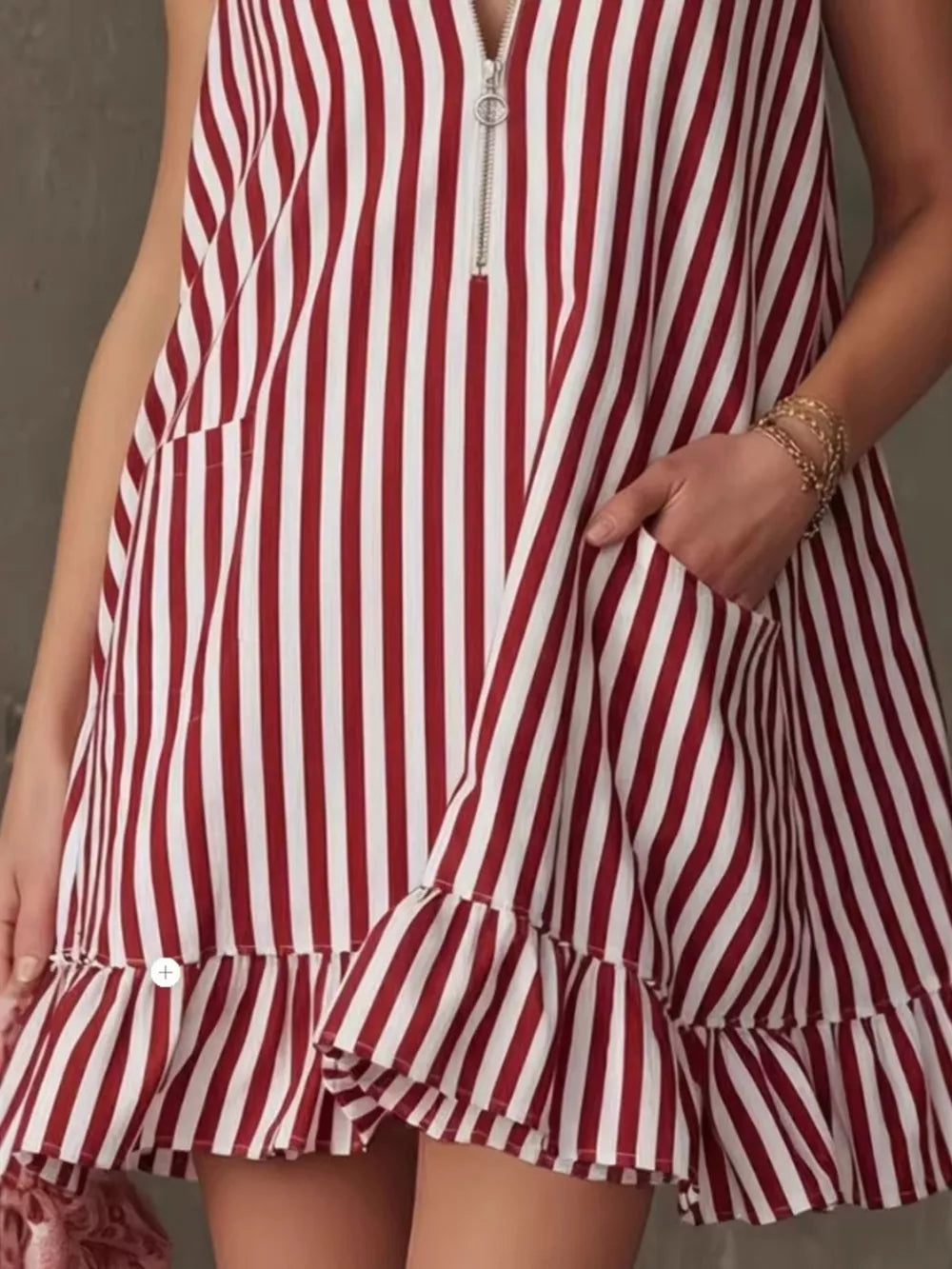 Striped mini dress with zipper, pockets, and ruffle hem in Burgundy.