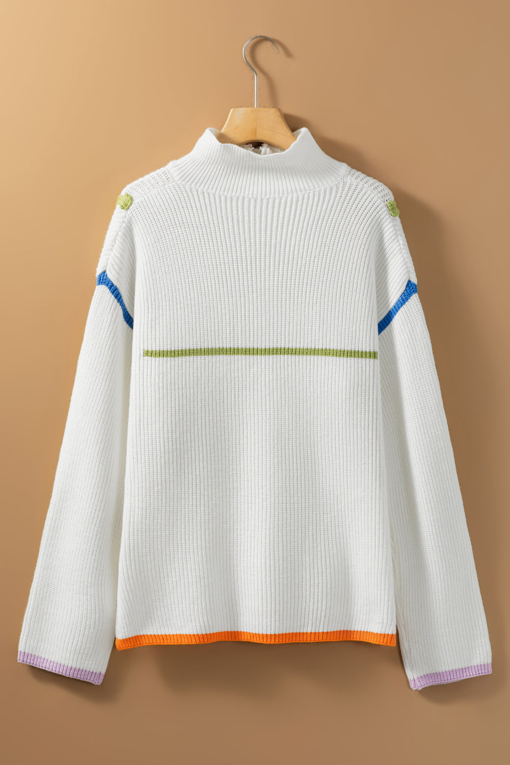 White ribbed knit sweater with colorblock details, mock neck, and striped hem.