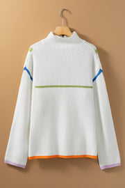 White ribbed knit sweater with colorblock details, mock neck, and striped hem.