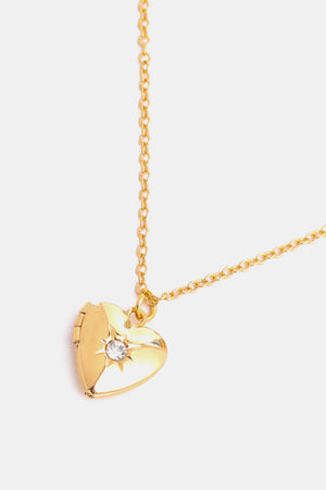 Gold heart locket necklace with crystal accent and delicate chain