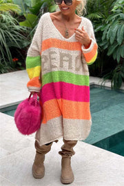 Beige knit midi sweater dress with rainbow stripes and "PEACE" lettering, V-neck, long sleeves.