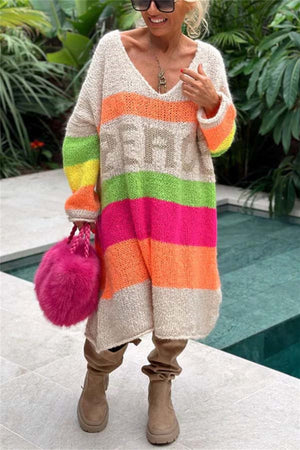 Beige knit midi sweater dress with rainbow stripes and "PEACE" lettering, V-neck, long sleeves.