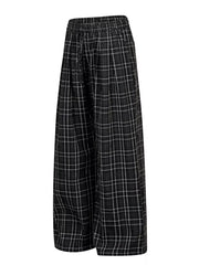 Plaid wide-leg sweatpants with drawstring waist in black and white check.