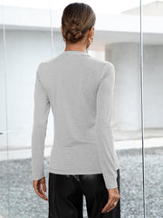 Ribbed Henley stripe top in gray with long sleeves and button detail.