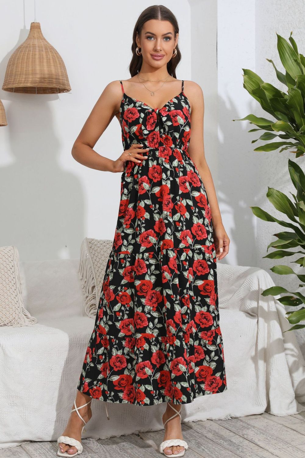 Floral print maxi dress with tiered skirt and spaghetti straps.