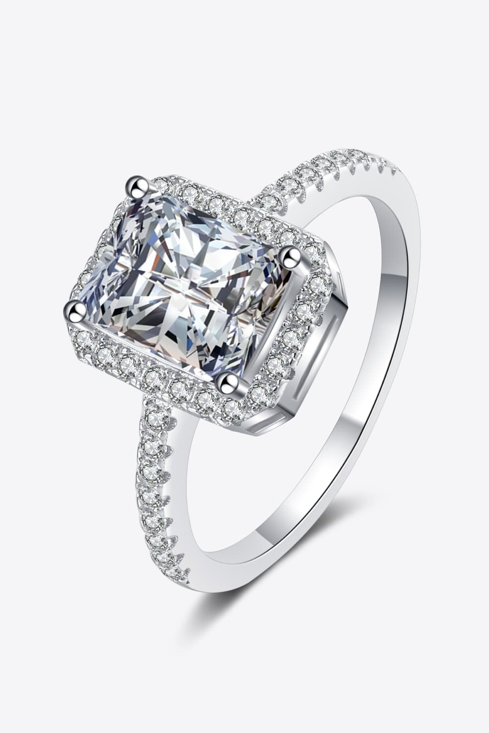 Radiant cushion cut halo ring in silver with pave band.