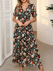 Black floral print maxi dress with ruffled V-neck, cinched waist, and short flutter sleeves.