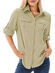 Sage roll-up sleeve button-up shirt with two chest pockets and a zippered pocket.