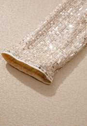 Sequin wrap bodysuit in ivory with a deep V-neck and long sleeves.