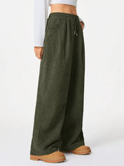 Army green corduroy maternity trousers with wide legs and drawstring waist.
