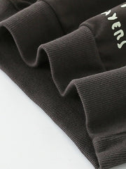 Coffee brown cotton blend sweatshirt with graphic detail and ribbed cuffs.