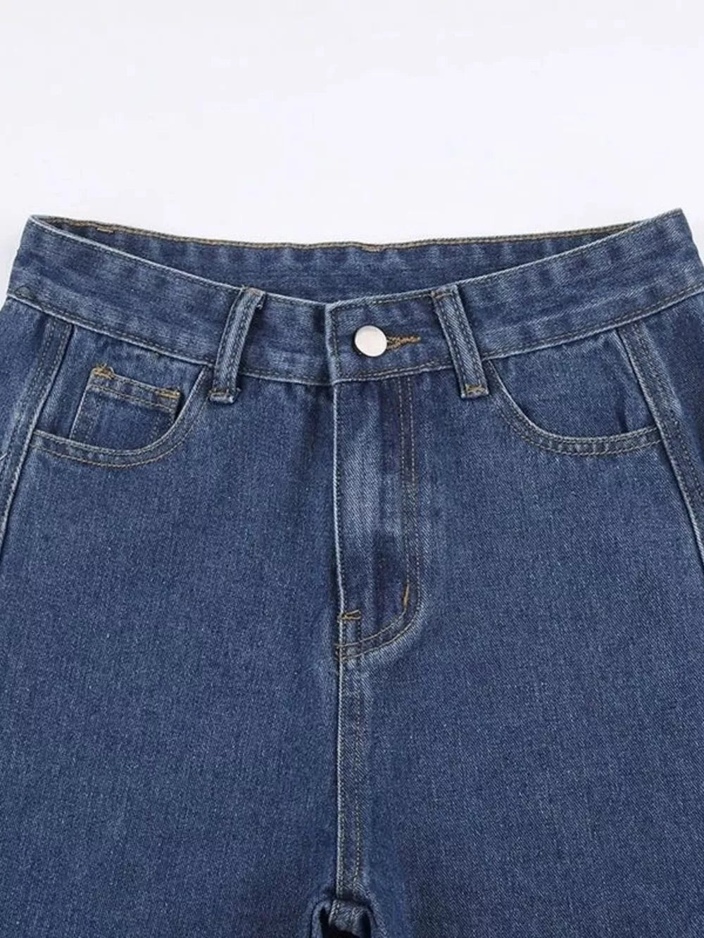 Blue denim jeans with distressed side cutouts and lace-up detail.