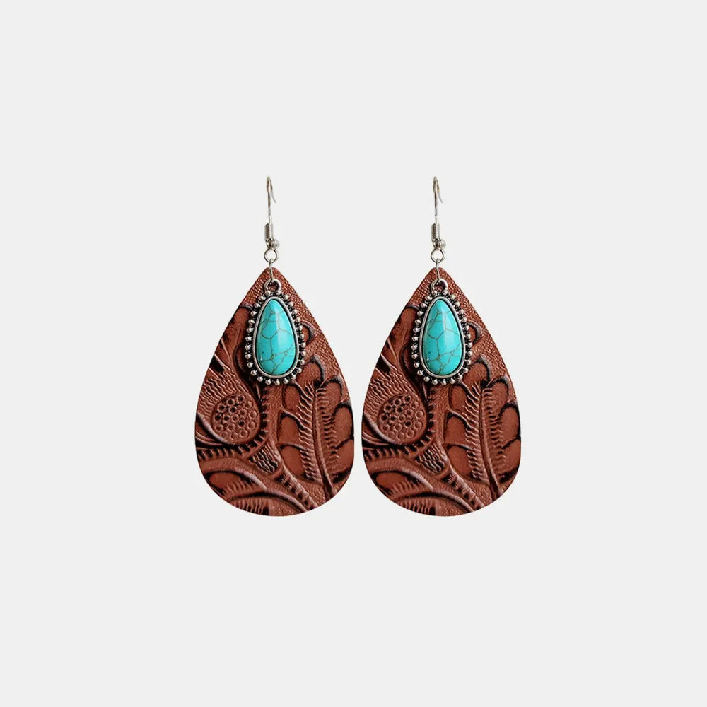 Brown tooled leather teardrop earrings with turquoise stone detail