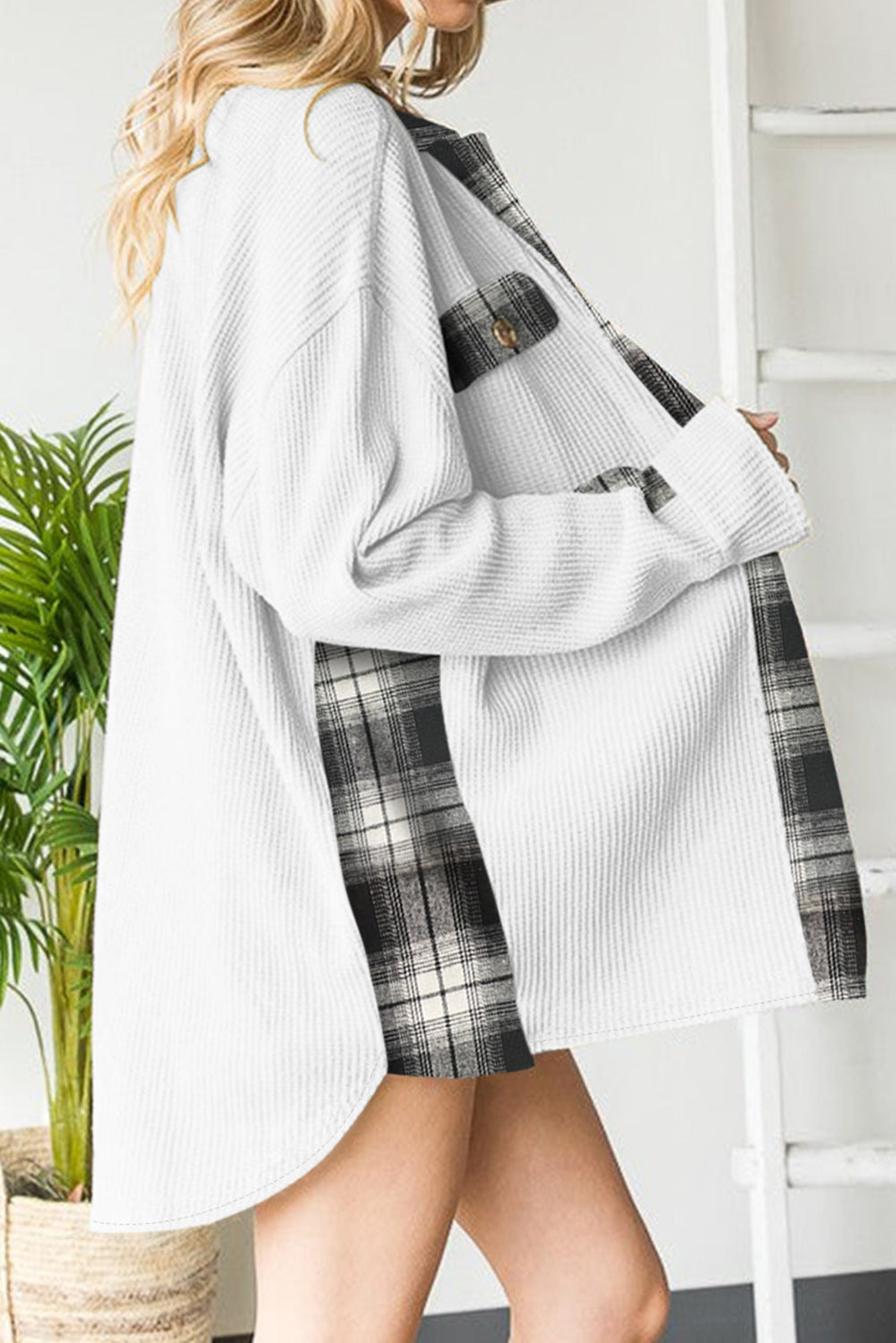 White waffle knit overshirt with plaid trim and button pocket detail.
