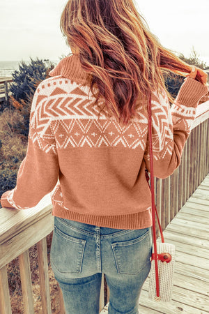 Geometric knit zip-neck pullover in rust with white pattern, featuring a cozy knit texture and a shawl collar.