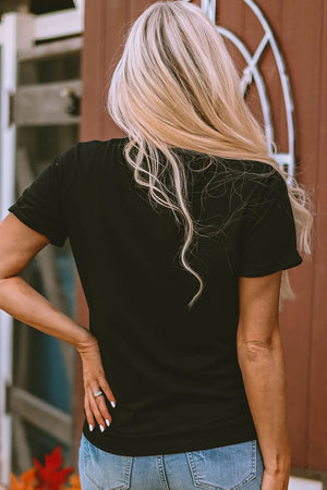 Black short sleeve t-shirt with rolled cuffs and a graphic print on the back.
