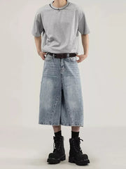 Men's light wash denim wide-leg capris with relaxed fit and cargo pockets.