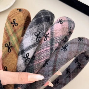 Embroidered plaid padded headbands in blush pink, camel, and dark gray.