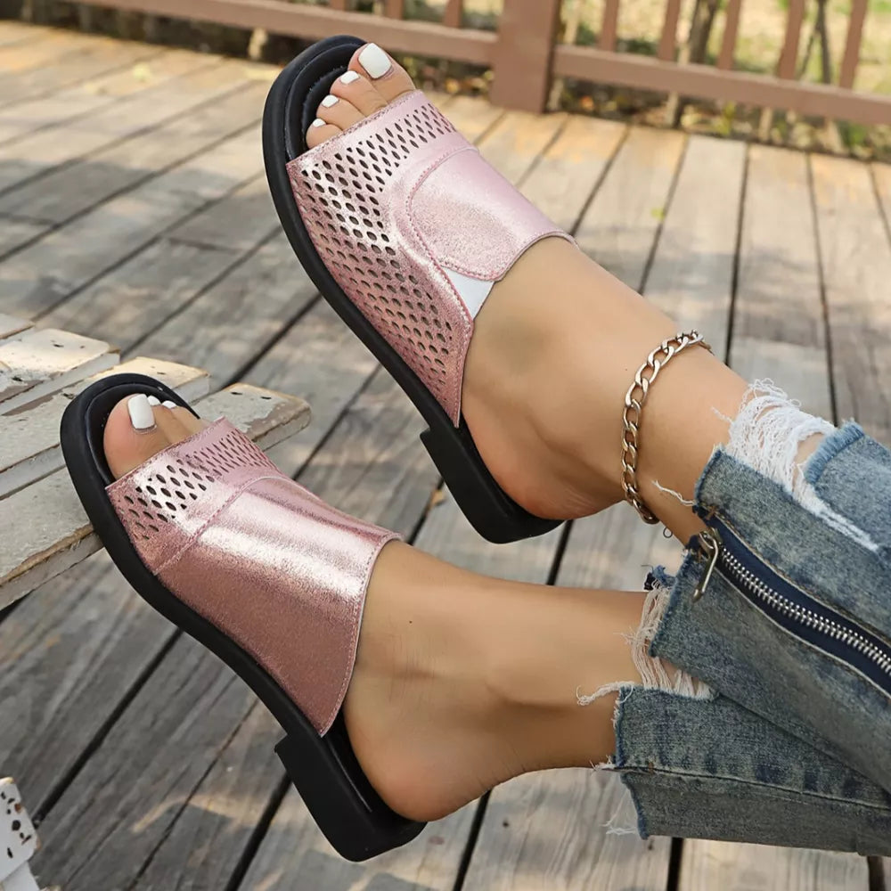Chic pink hollow-out slide sandals with breathable mesh detail.