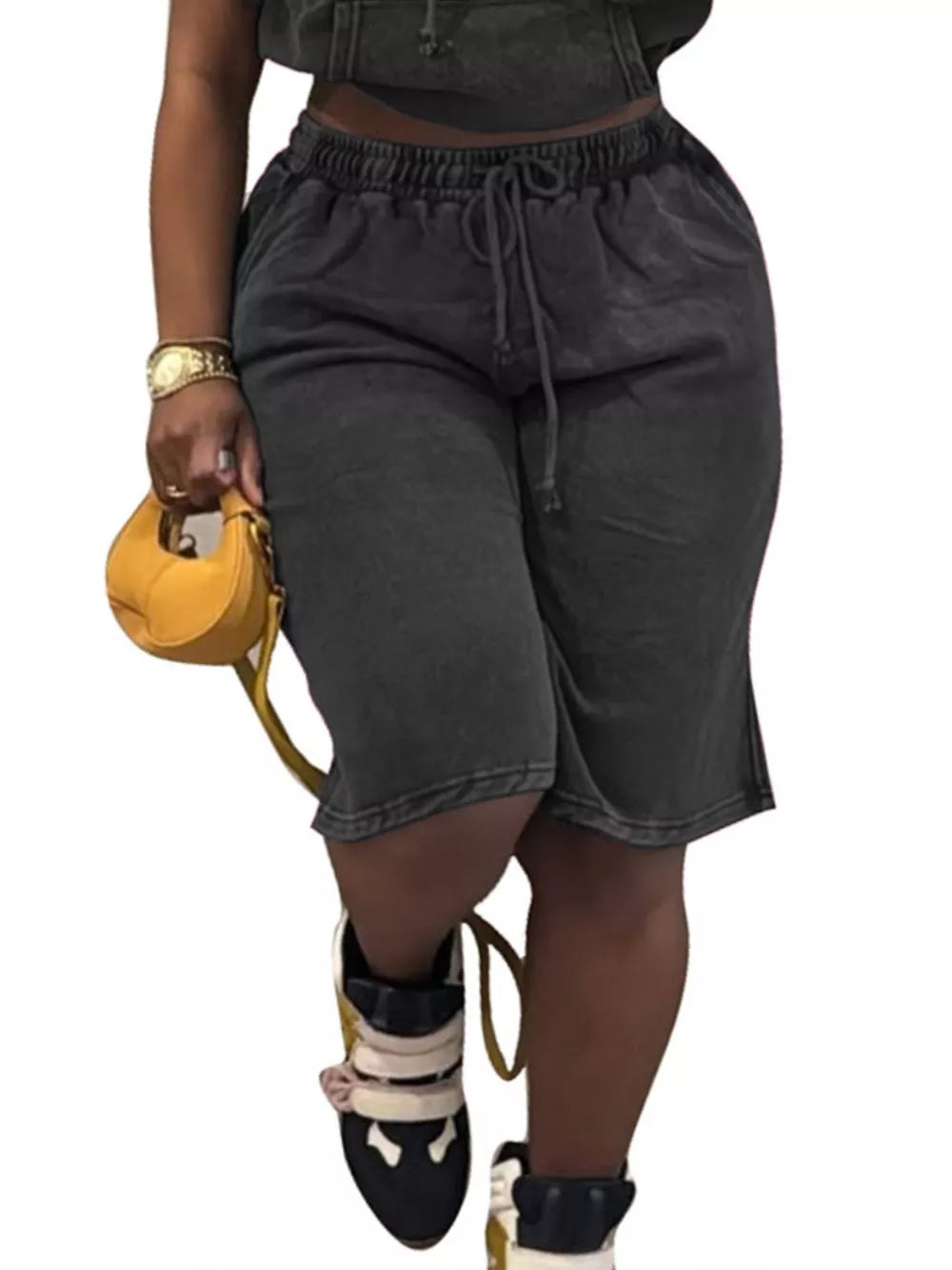 Black cotton drawstring shorts with elastic waistband and relaxed fit.