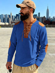 Blue long-sleeve men's t-shirt with lace-up neckline and tan elbow patches.