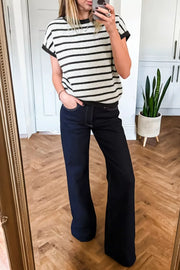 Chic black and white striped knit top with short sleeves and a bow detail.