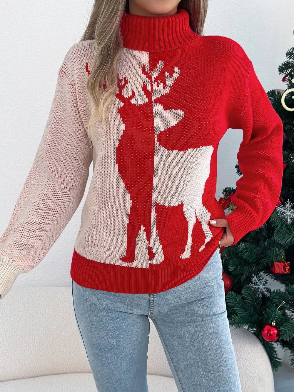 Red and cream colorblock knit sweater with reindeer graphic and turtleneck.