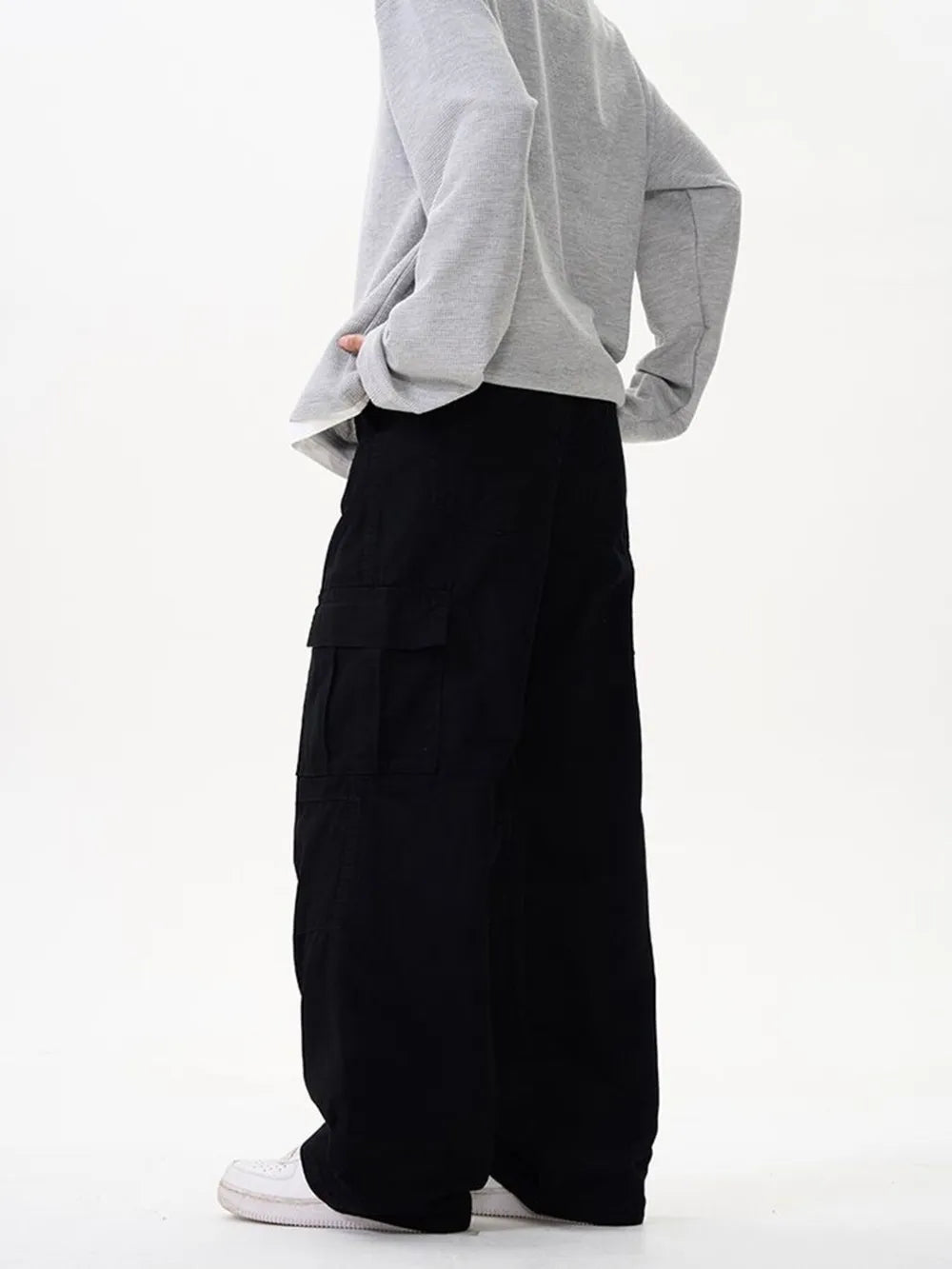 Black cargo pants with multiple versatile pockets and a relaxed fit.
