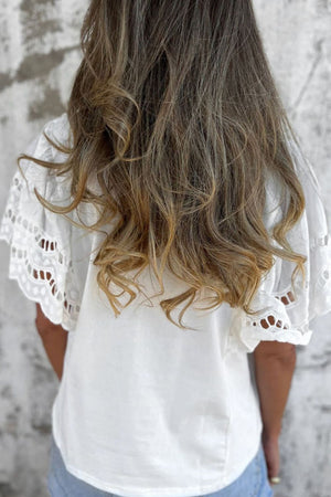 White cotton tee with eyelet lace inset short sleeves.