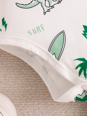 Baby bodysuit with dinosaur, surfboard, and palm tree print.
