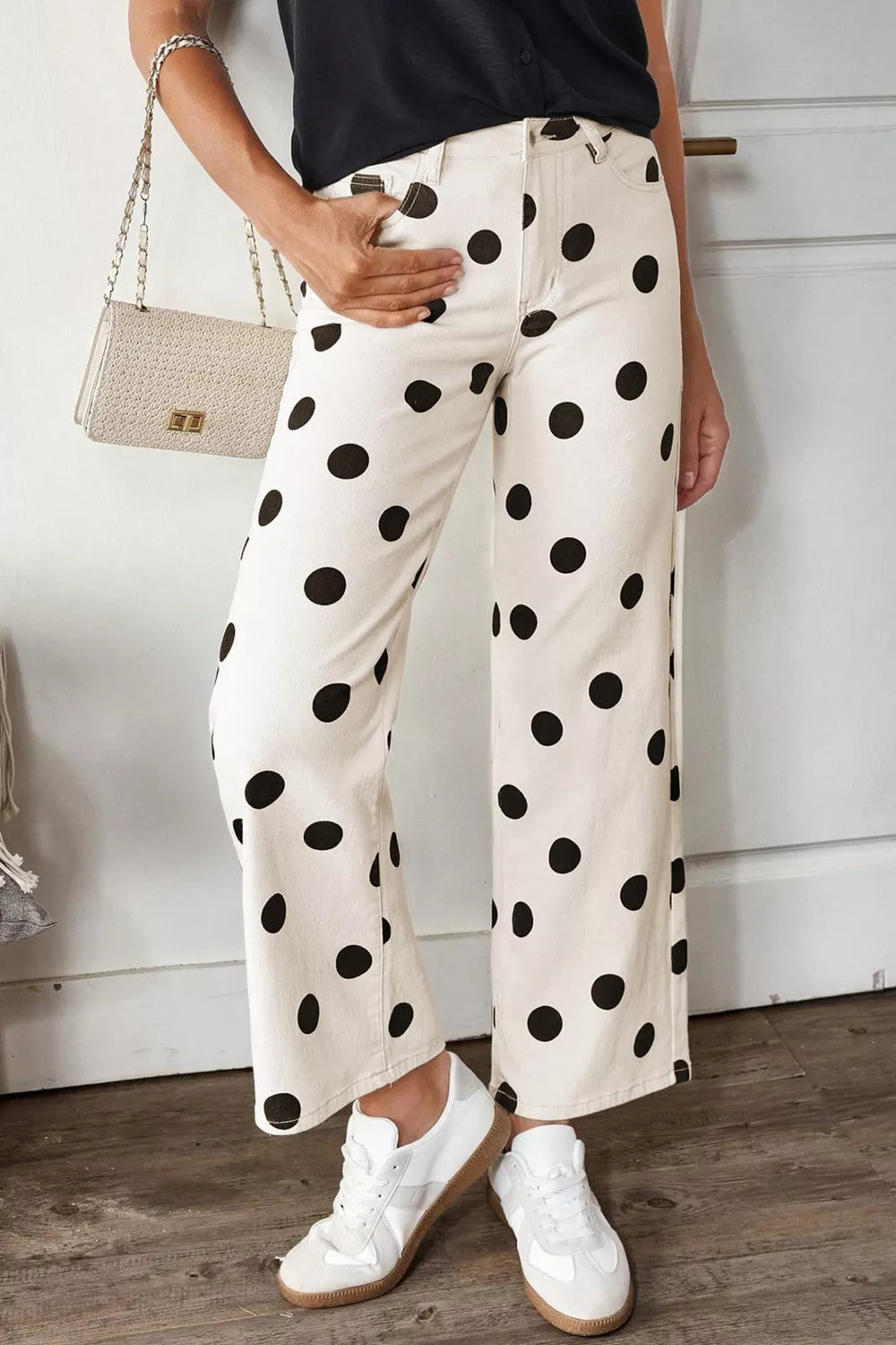 Cream polka dot high-rise cotton jeans with a wide leg and ankle length.