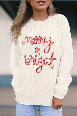 Ivory knit sweater with red candy cane script text that reads "merry & bright".