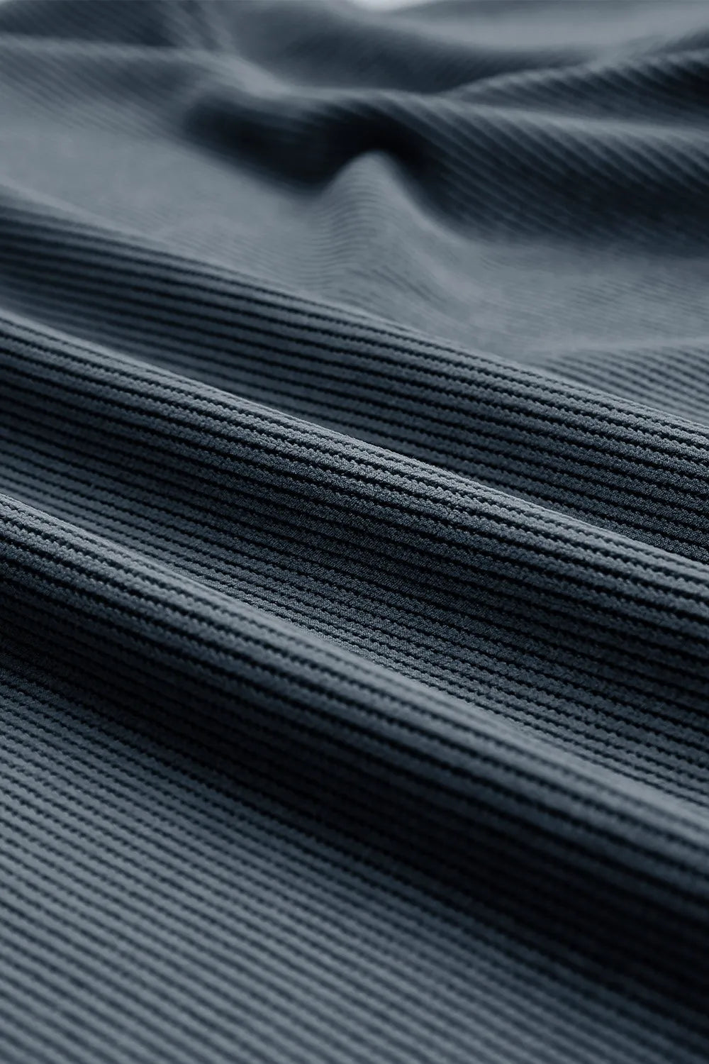 Deep teal ribbed crewneck sweatshirt with a textured fabric detail