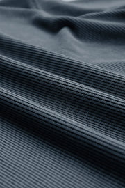 Deep teal ribbed crewneck sweatshirt with a textured fabric detail